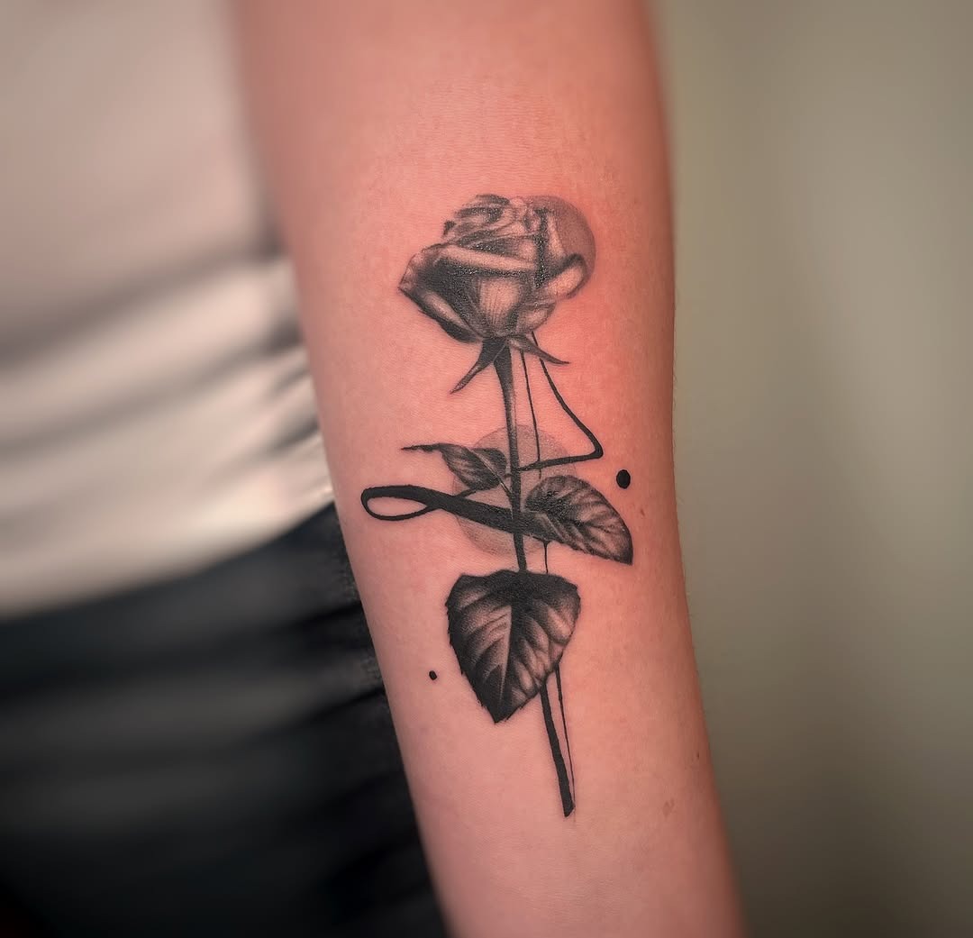 Elegant black and gray rose tattoo on forearm Tattoo Design