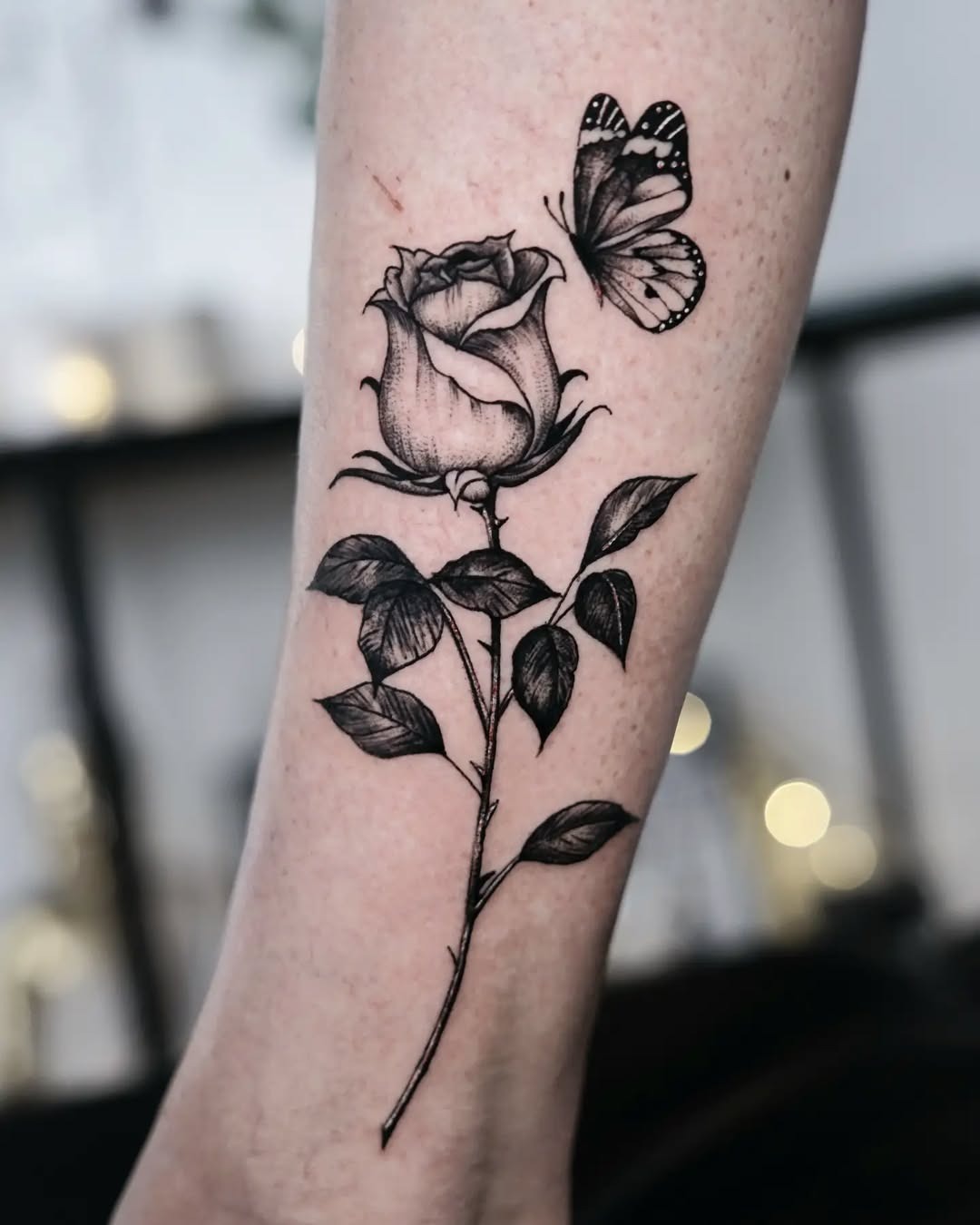 Elegant black and gray rose with butterfly tattoo Tattoo Design