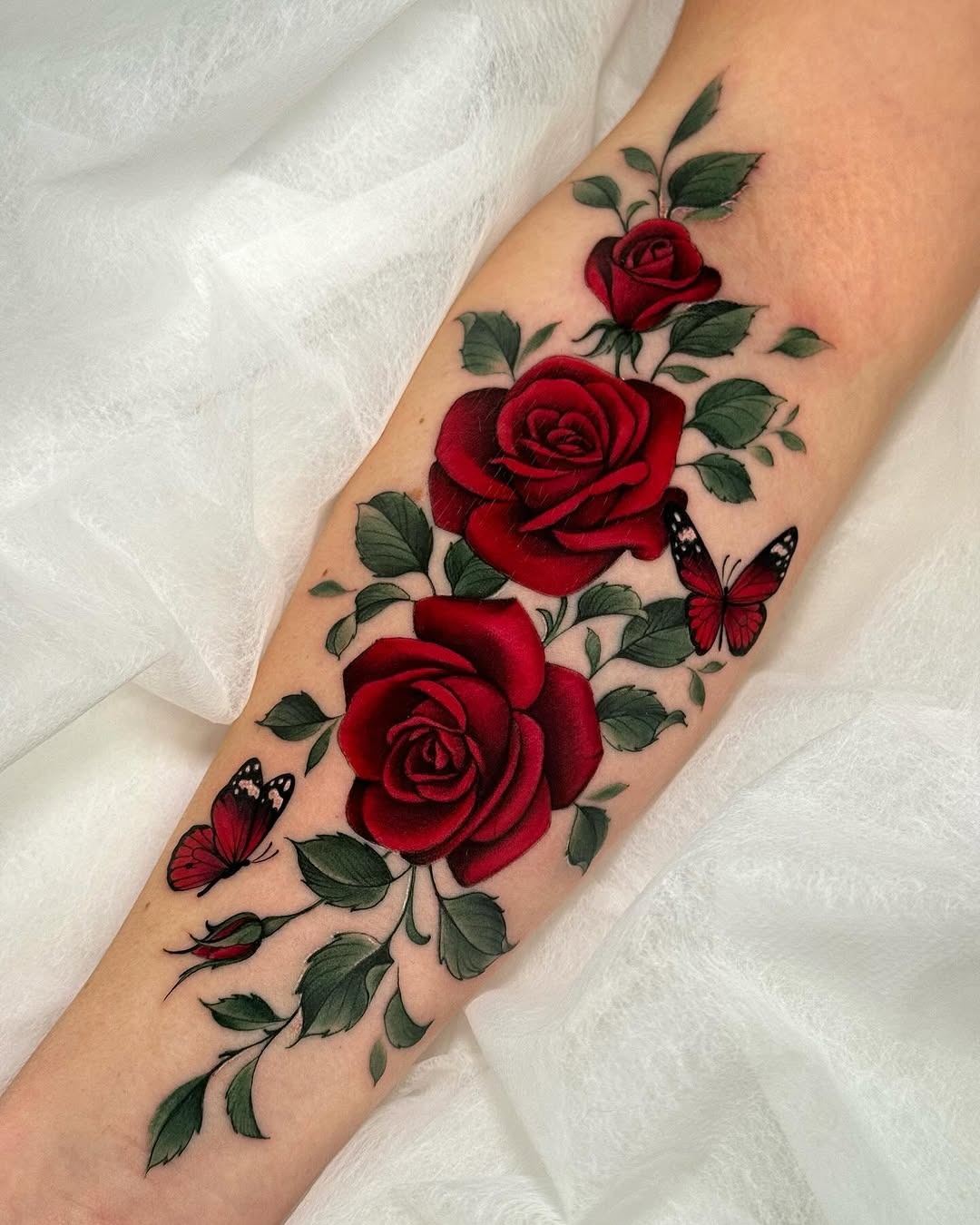 Elegant red roses with delicate butterflies design Tattoo Design