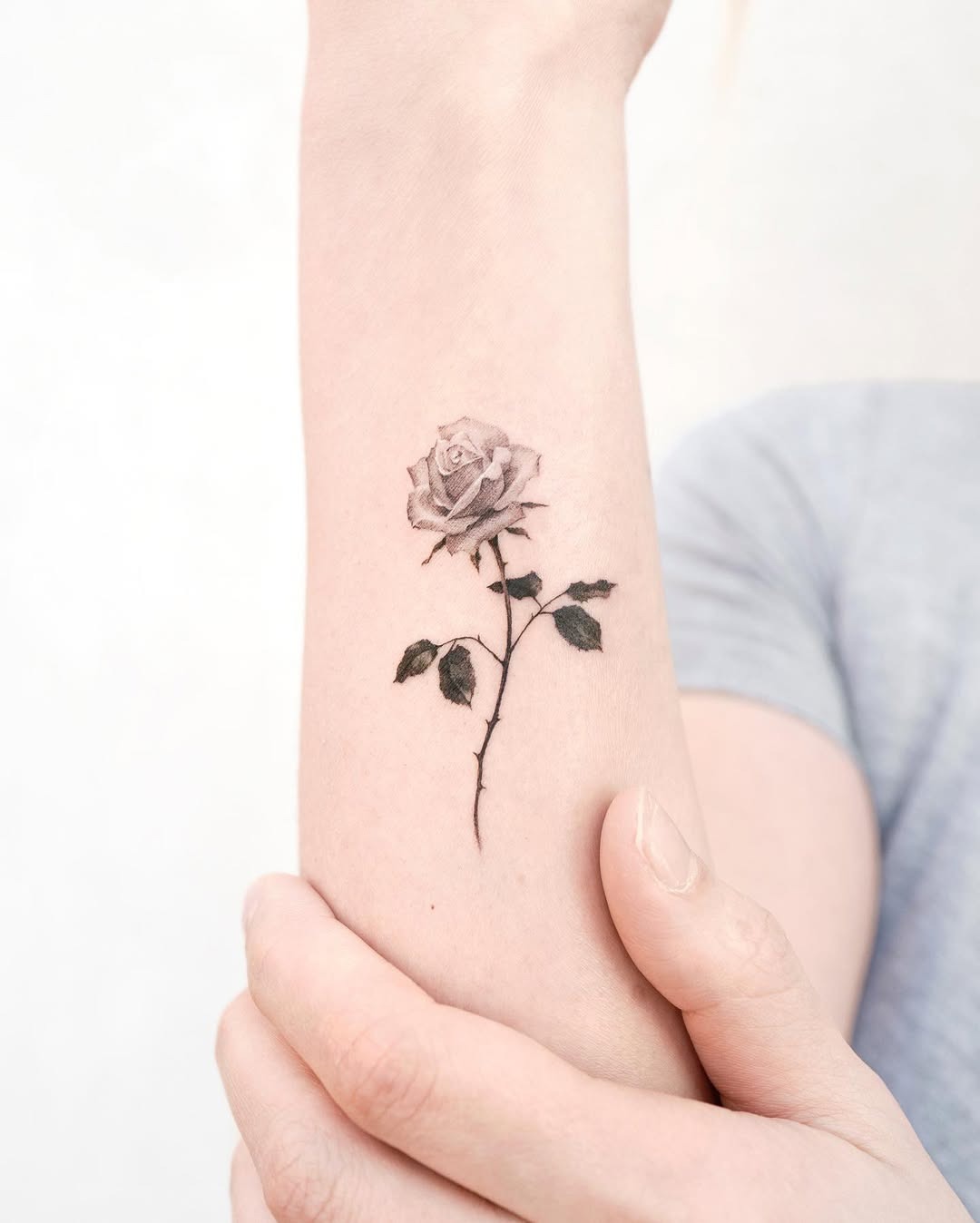 Elegant rose tattoo on a forearm Tattoo Design