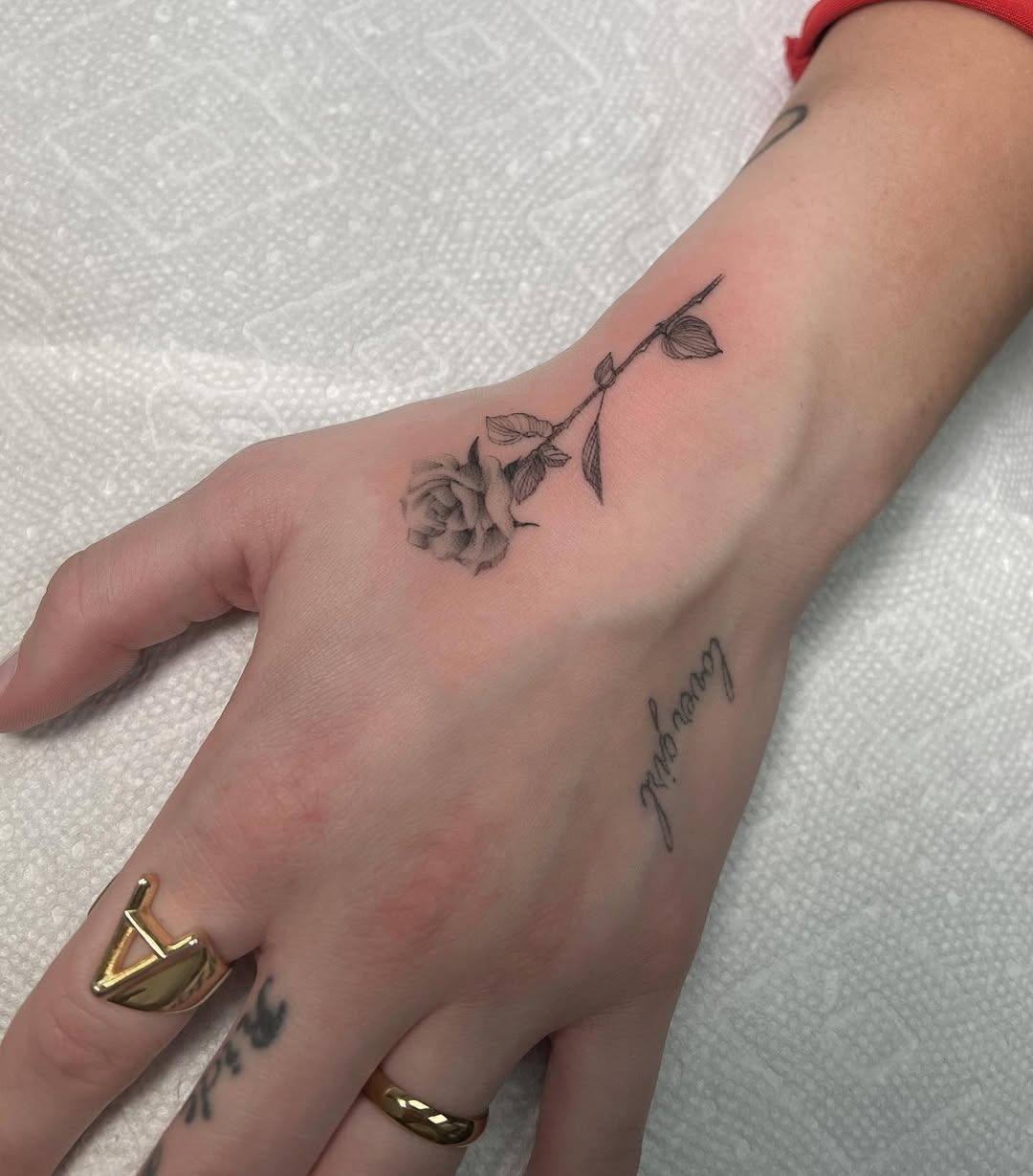 Elegant rose tattoo on the hand Tattoo Design