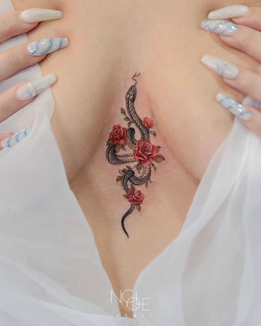 Elegant Snake Wrapped in Vibrant Roses Tattoo Design