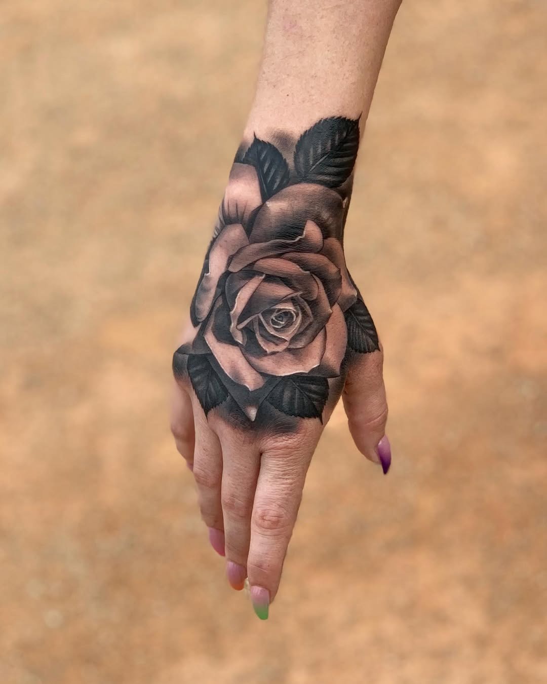 Stunning Black and Gray Rose Hand Tattoo Tattoo Design
