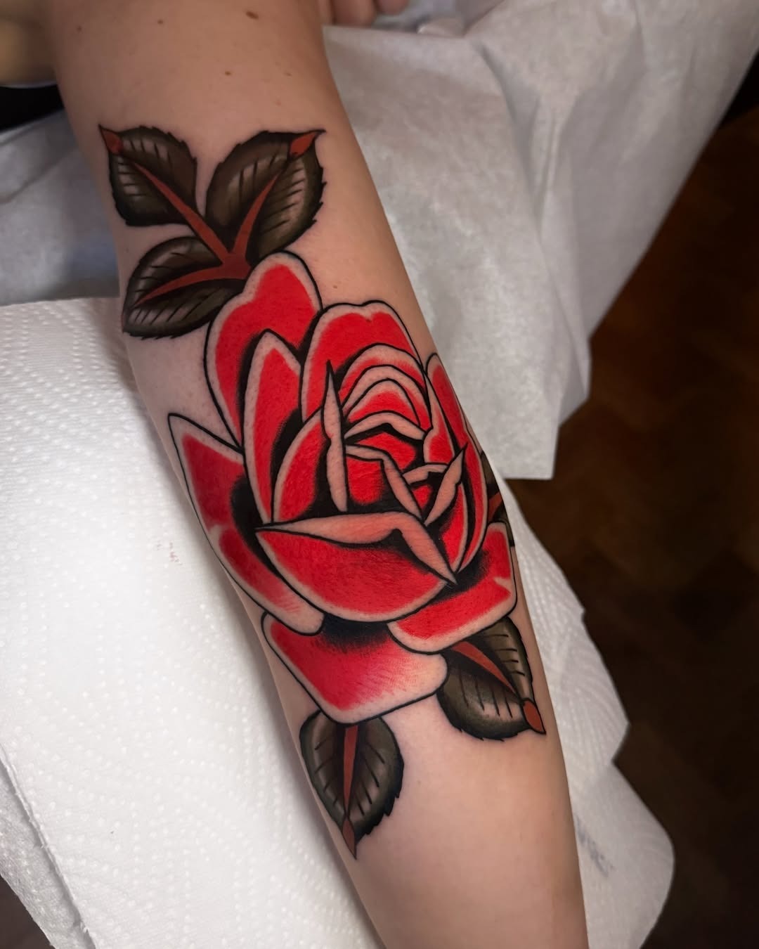 Stunning red rose tattoo on the forearm Tattoo Design