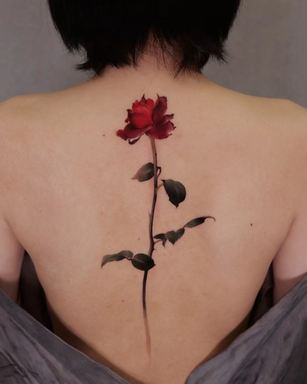 Stunning rose tattoo on a bare back Tattoo Design