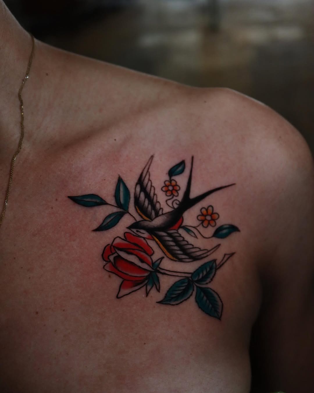 Vibrant rose and swallow tattoo on shoulder Tattoo Design