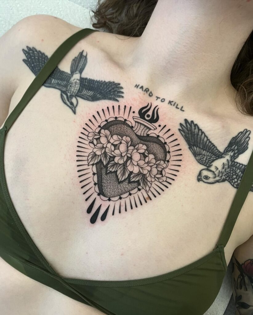 Colorful Sacred Heart Tattoo with Flower in Traditional Style Tattoo Design