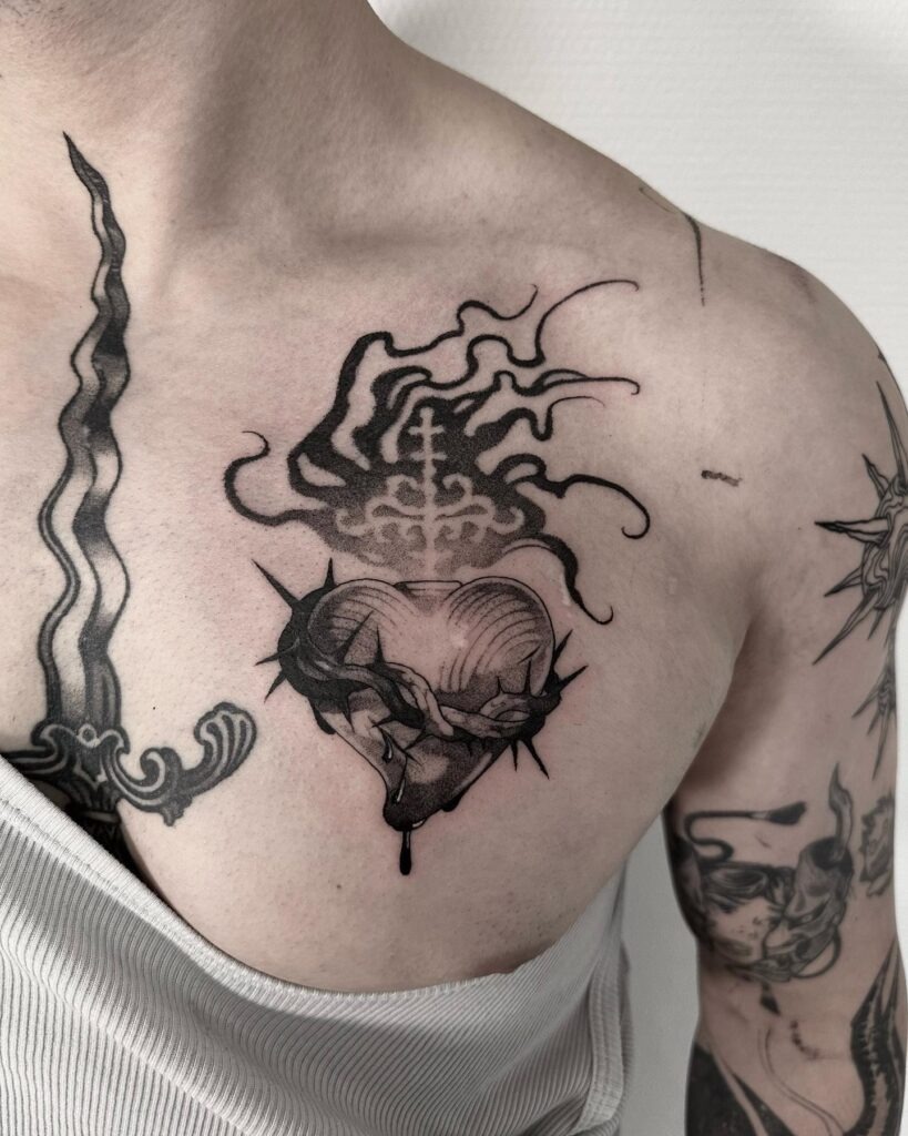 Ornate Sacred Heart with Floral and Sword Accents Tattoo Design