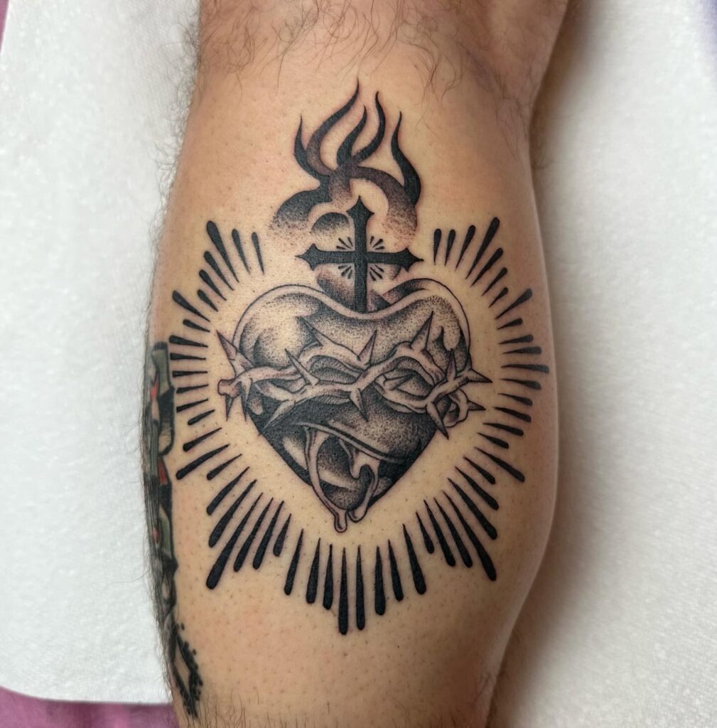 Sacred Heart Tattoo with Crown of Thorns, Flowers, and Cross Tattoo Design