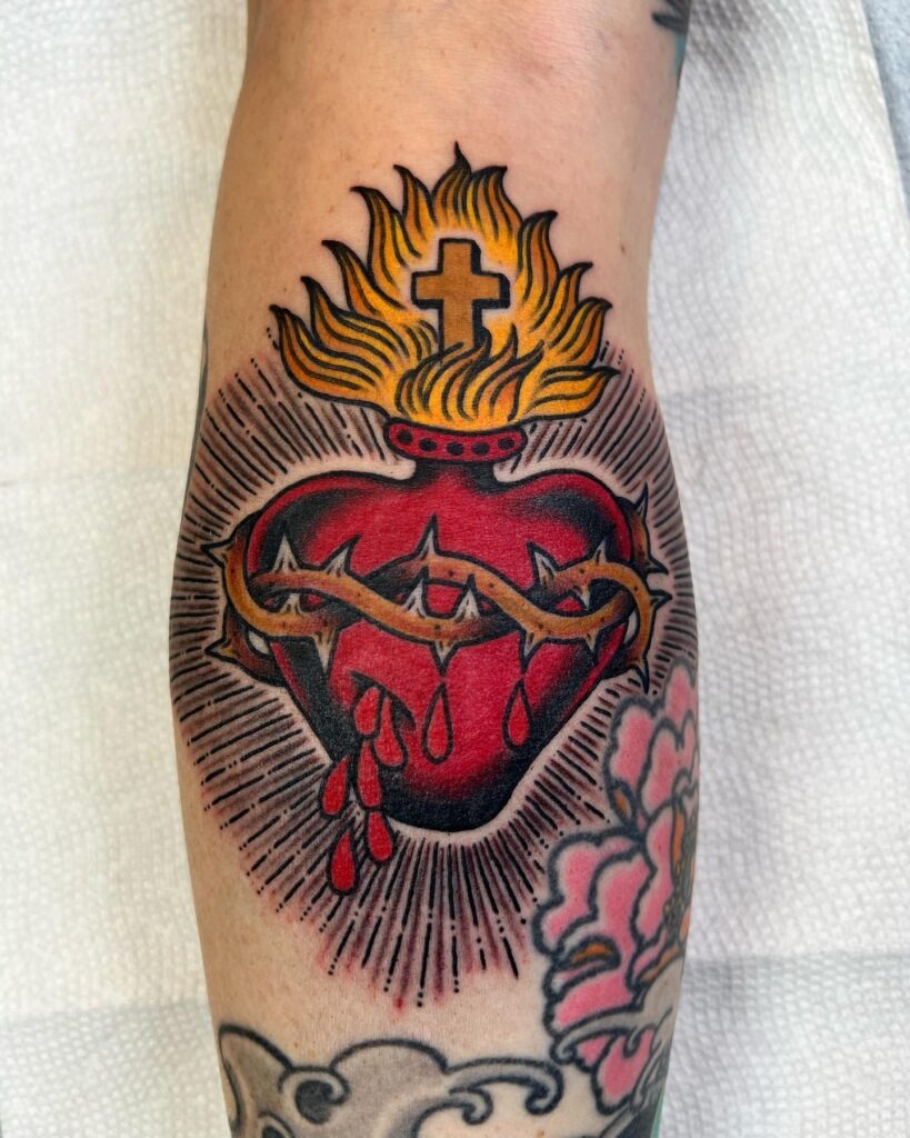 Traditional Sacred Heart Tattoo with Flowers and Flames Tattoo Design