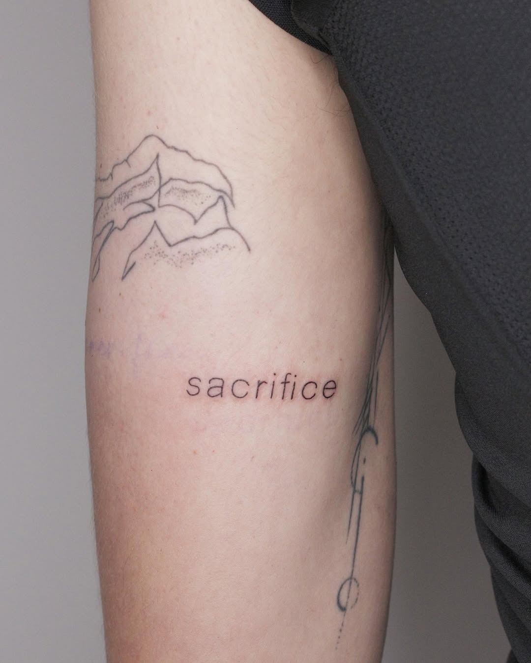Minimalist tattoo expressing the theme of sacrifice Tattoo Design