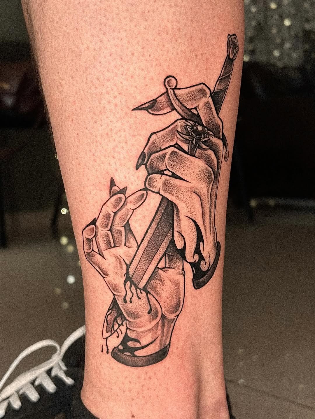 Powerful sacrificial tattoo with gripping hands Tattoo Design