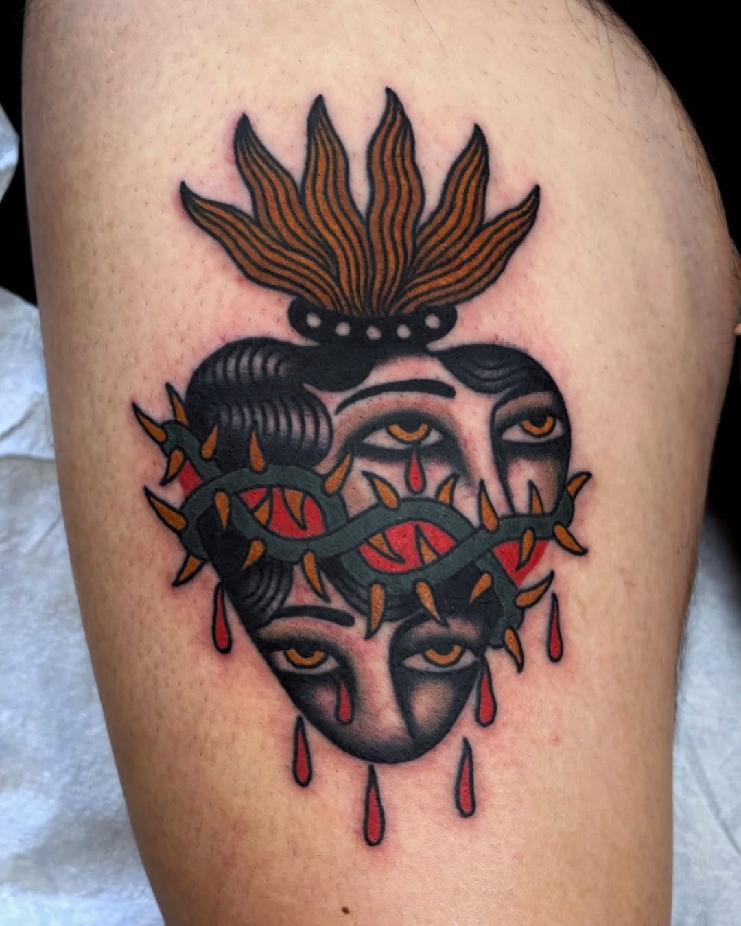 Unique Heart Tattoo with Dual Faces and Thorns Tattoo Design