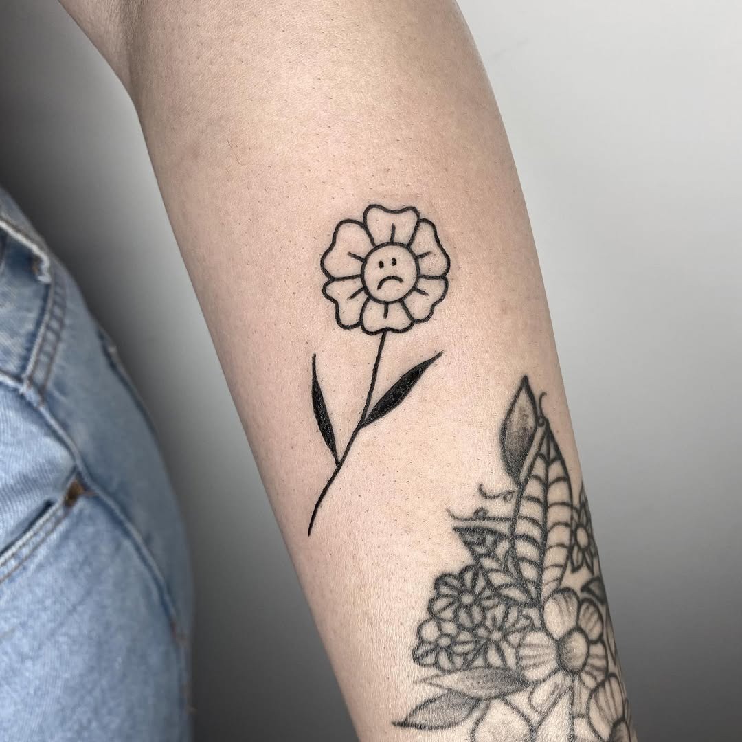 A melancholic flower tattoo expressing sadness Tattoo Design