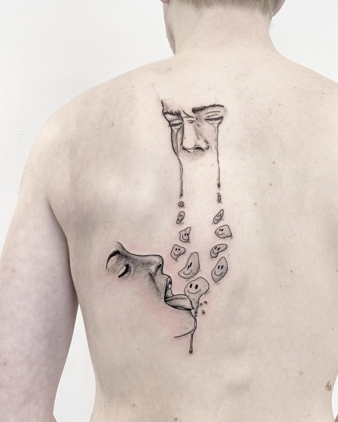 Emotive back tattoo depicting sadness and release Tattoo Design