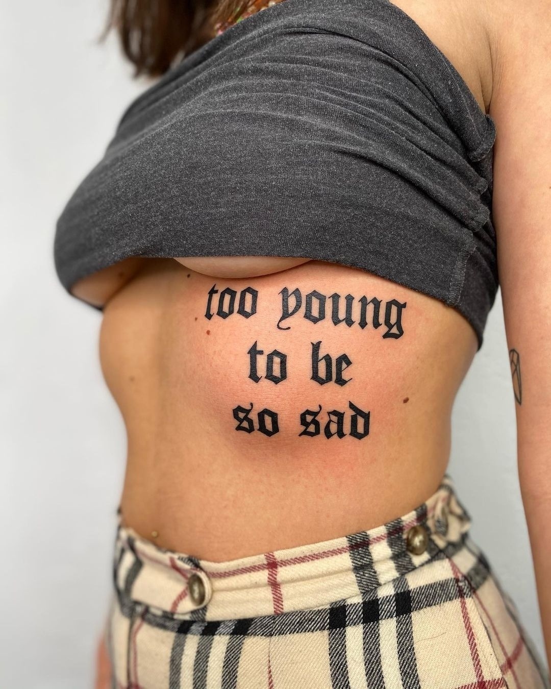 Expressing youth and melancholy through ink Tattoo Design