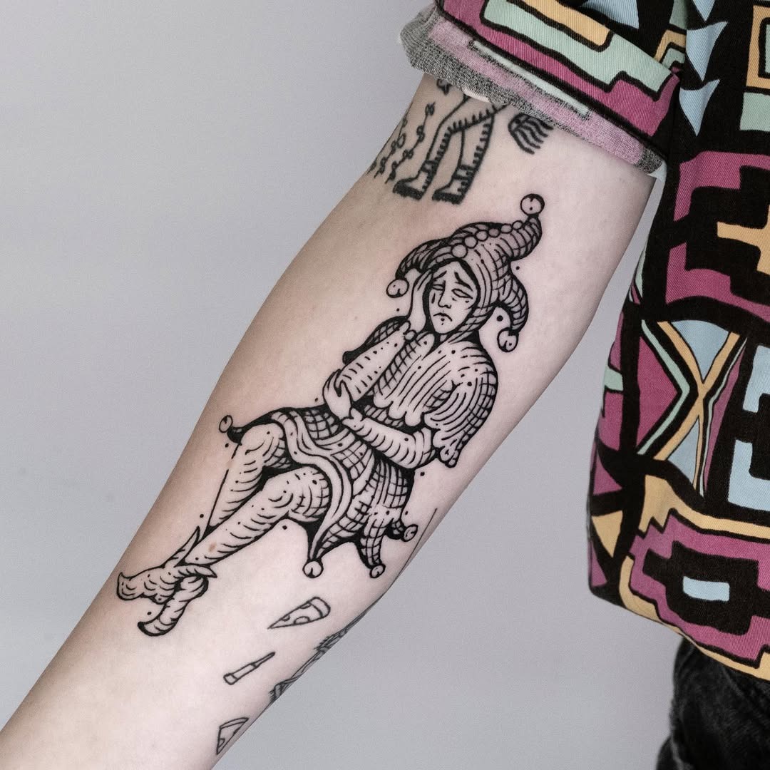 Expressive Jester Tattoo Conveying Melancholy Tattoo Design
