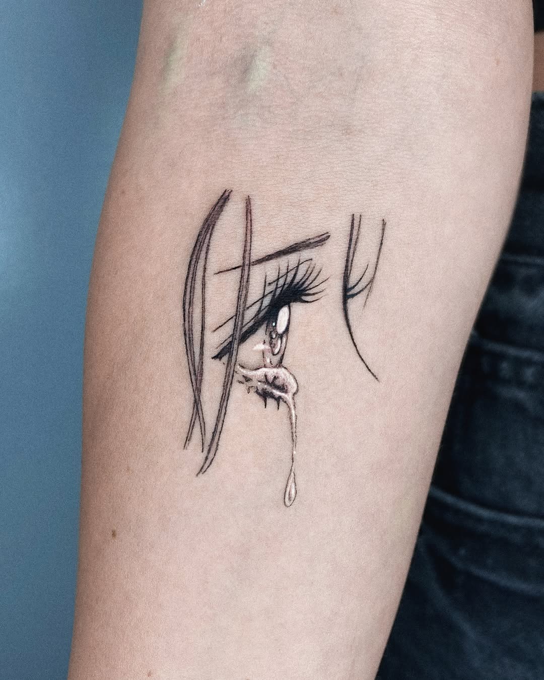 Expressive tear tattoo showcasing raw emotion Tattoo Design
