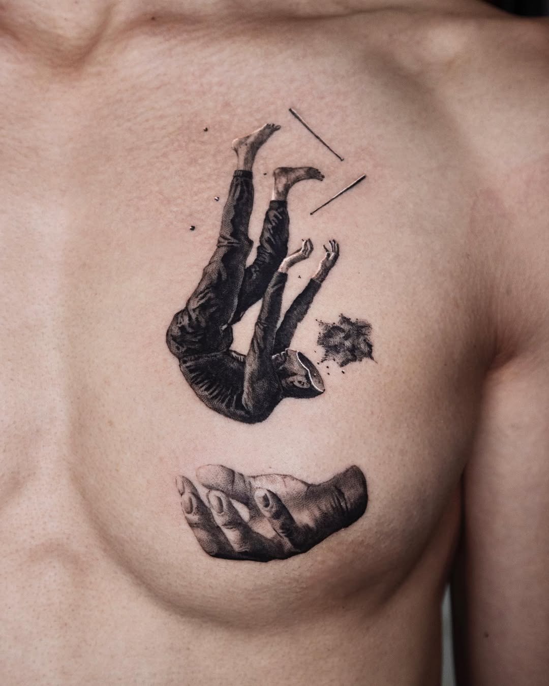 Falling figure tattoo with supporting hand motif Tattoo Design