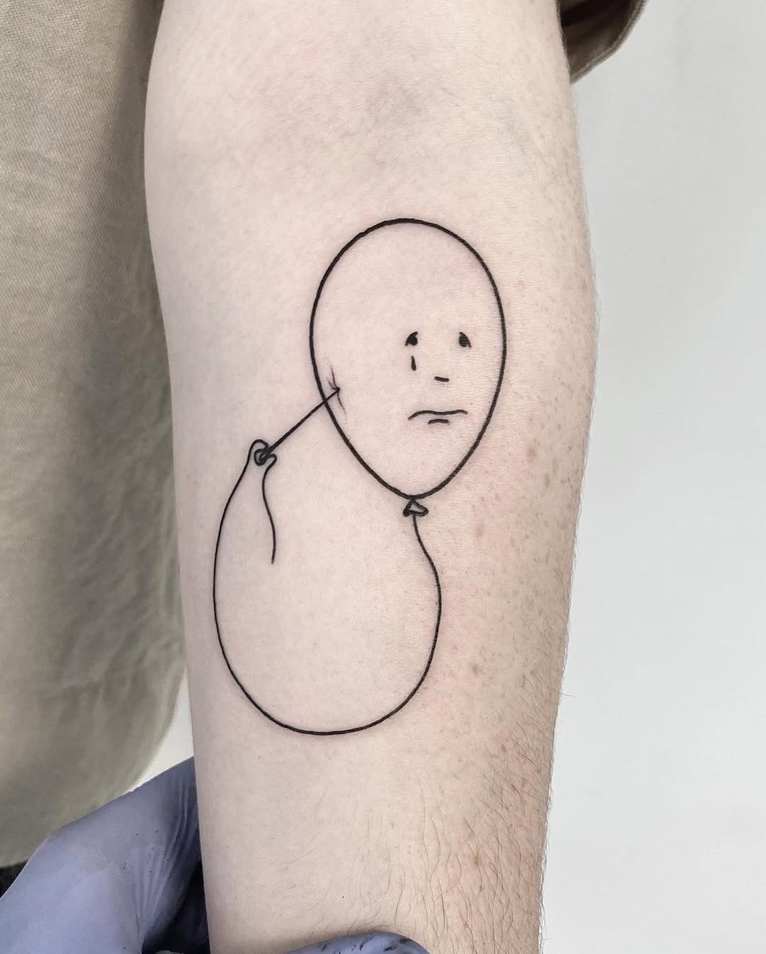 Minimalist tattoo reflecting deep, subtle sadness Tattoo Design