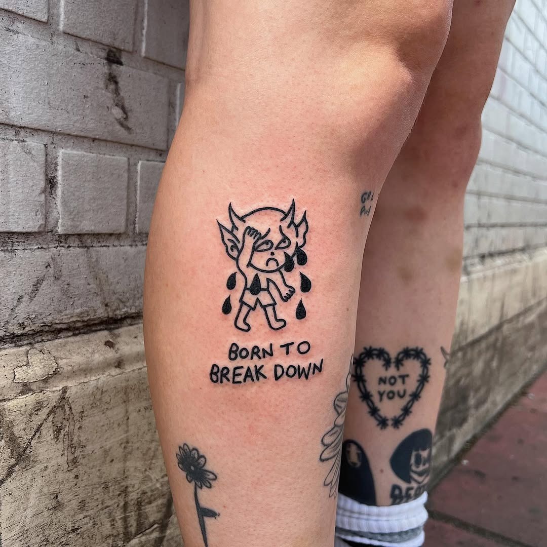 Whimsical tattoo of a tearful character Tattoo Design