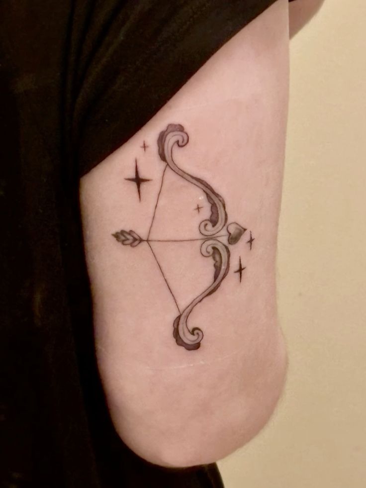 Delicate Ornamental Bow and Arrow Tattoo Design