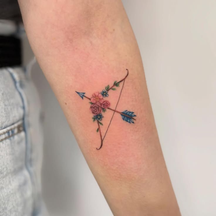 Tiny Floral Bow and Arrow Tattoo Design