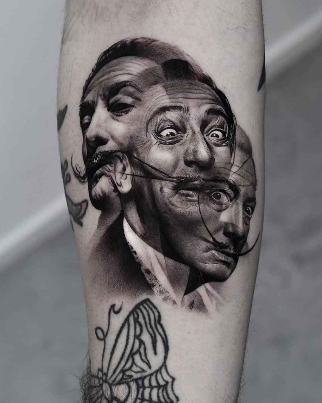 Intricate black and gray Dali portrait tattoo Tattoo Design