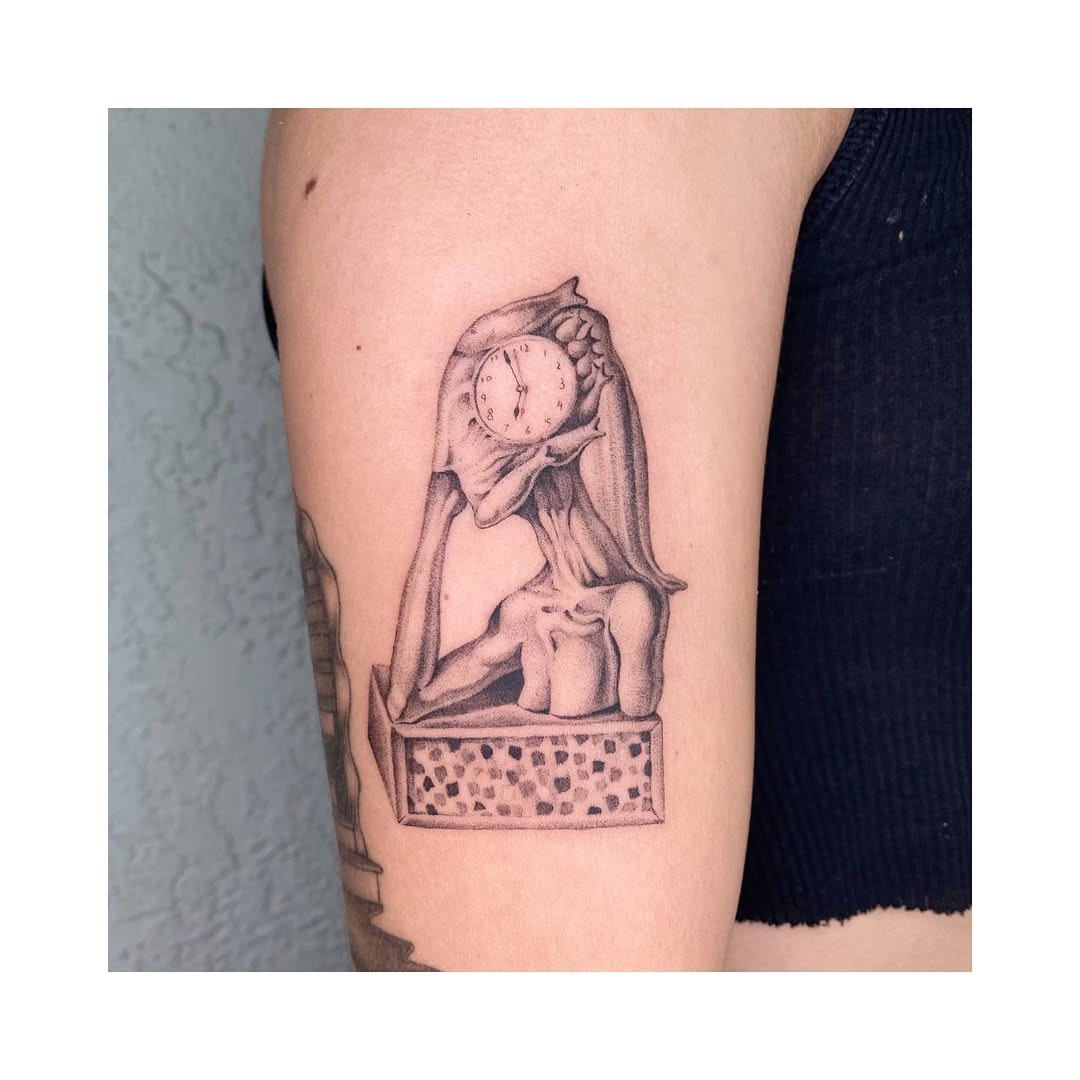 Intricate Salvador Dali clock tattoo design shown Tattoo Design