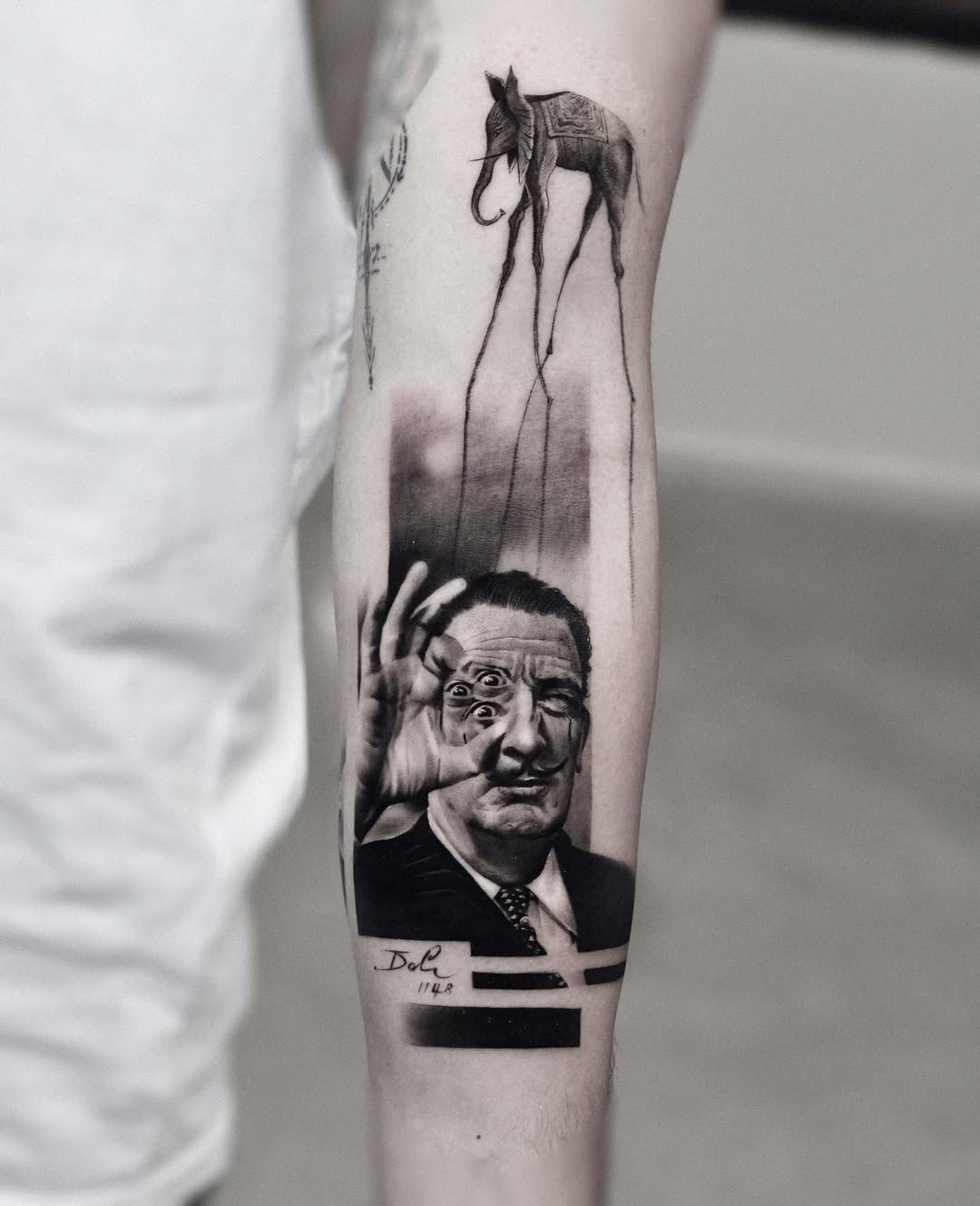 Intricate Salvador Dali tattoo showcasing surrealism Tattoo Design