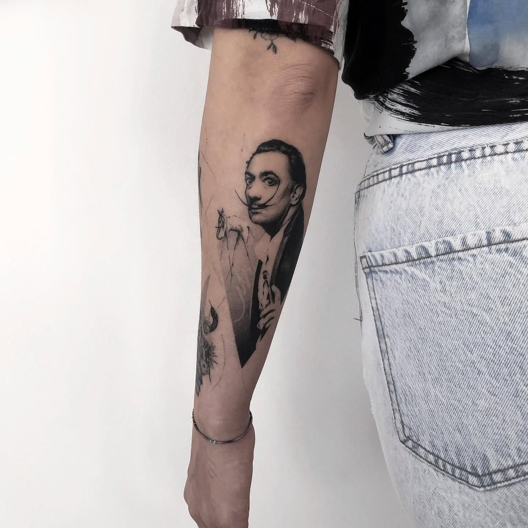 Intricate Salvador Dali Tribute Tattoo on Arm Tattoo Design