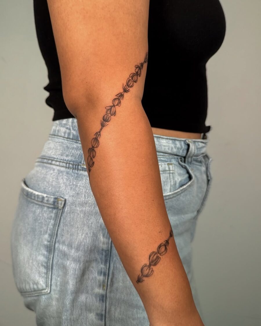 Elegant sampaguita tattoo gracefully wraps around elbow Tattoo Design