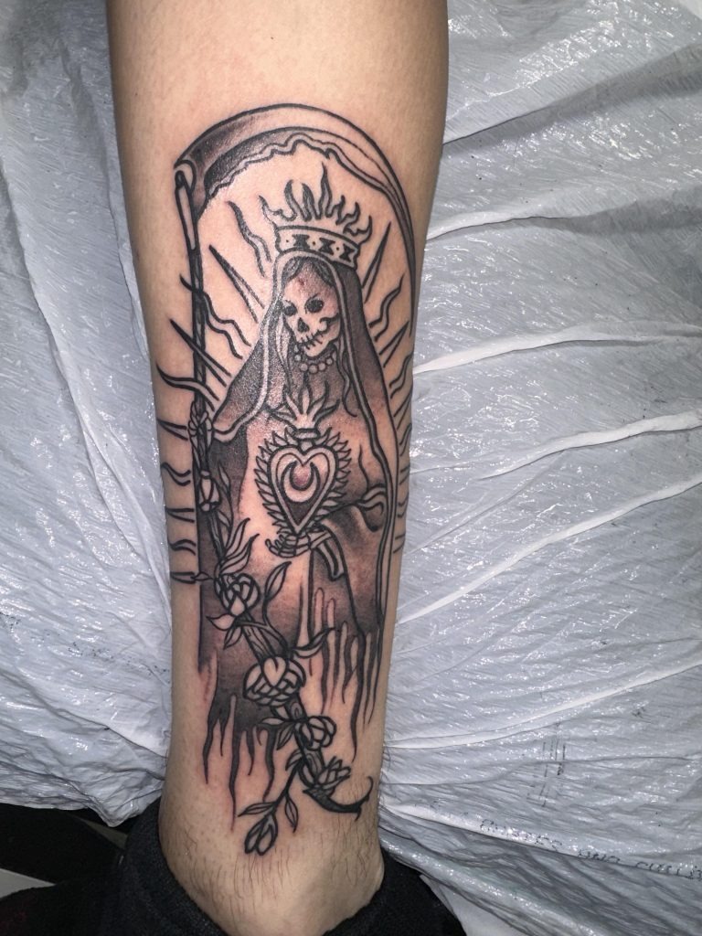 Wrist Tattoo Featuring Santa Muerte’s Gentle Gaze tattoo design