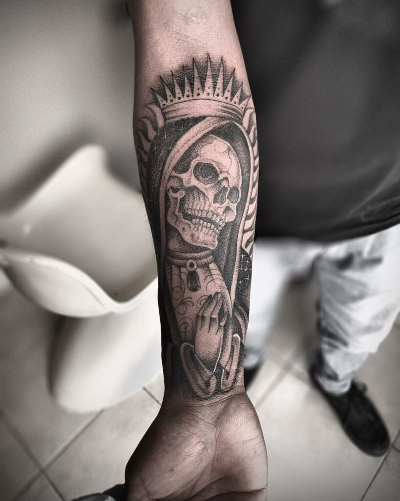Bold Upper Arm Santa Muerte with Sunburst Halo tattoo design