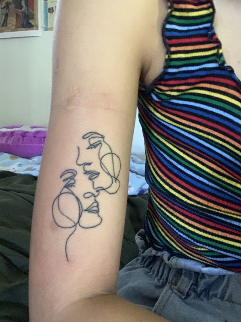 Intimate Line Art of Two Faces Tattoo Design
