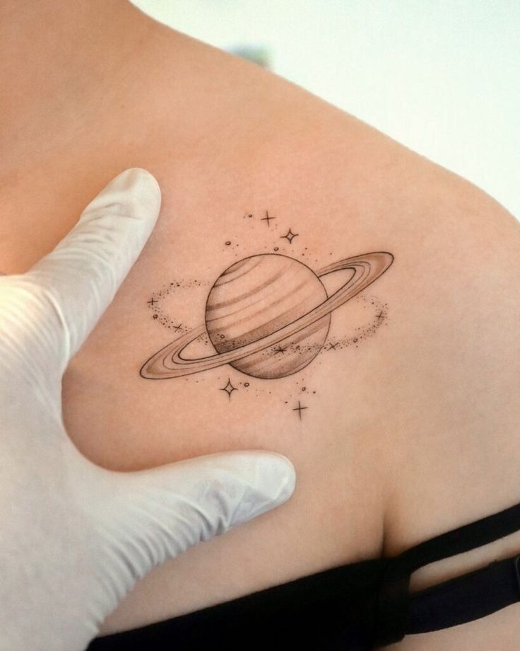 Neo-traditional Saturn with Starbursts Tattoo Design