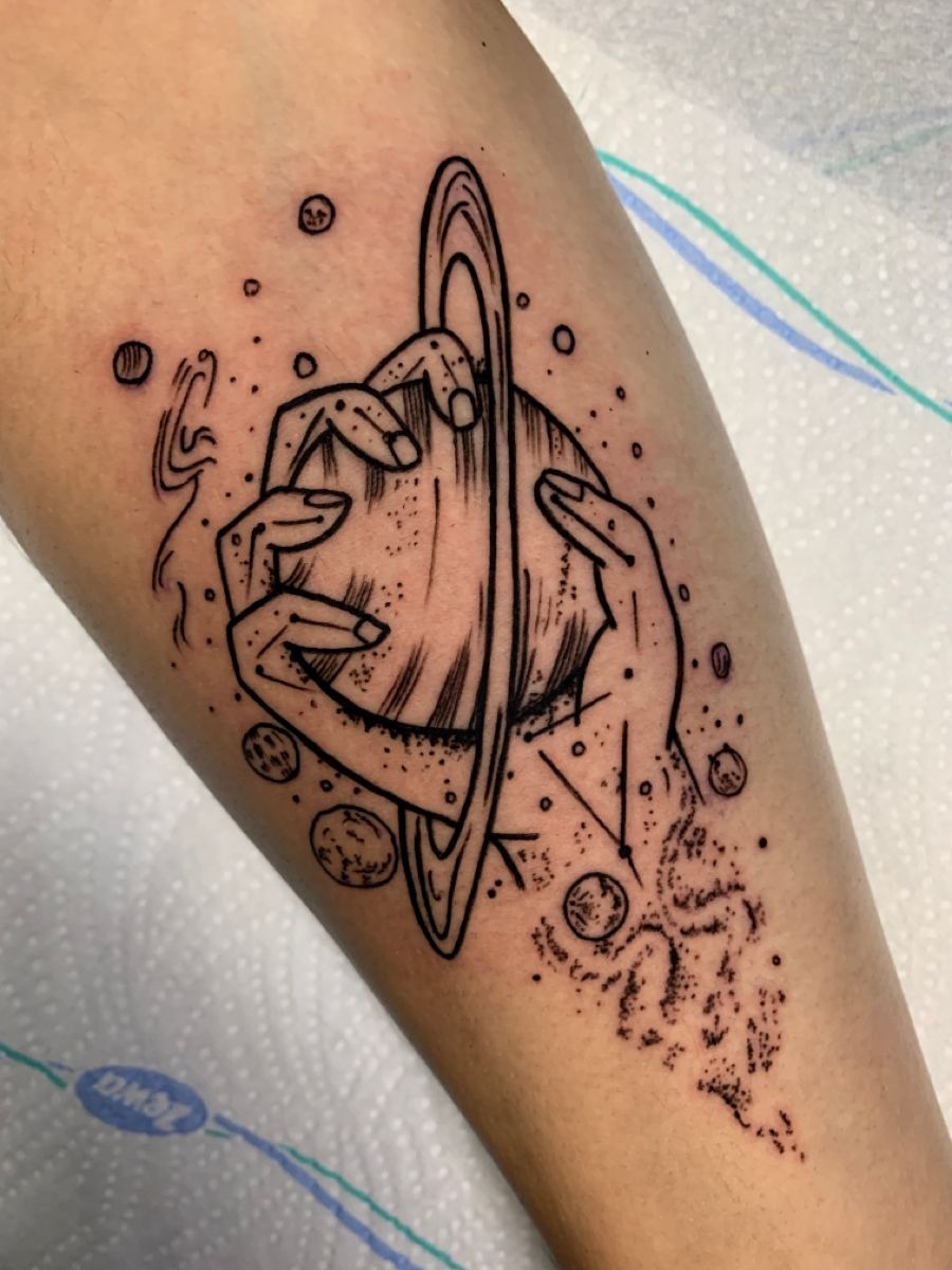 Tiny Saturn behind ear Tattoo Design