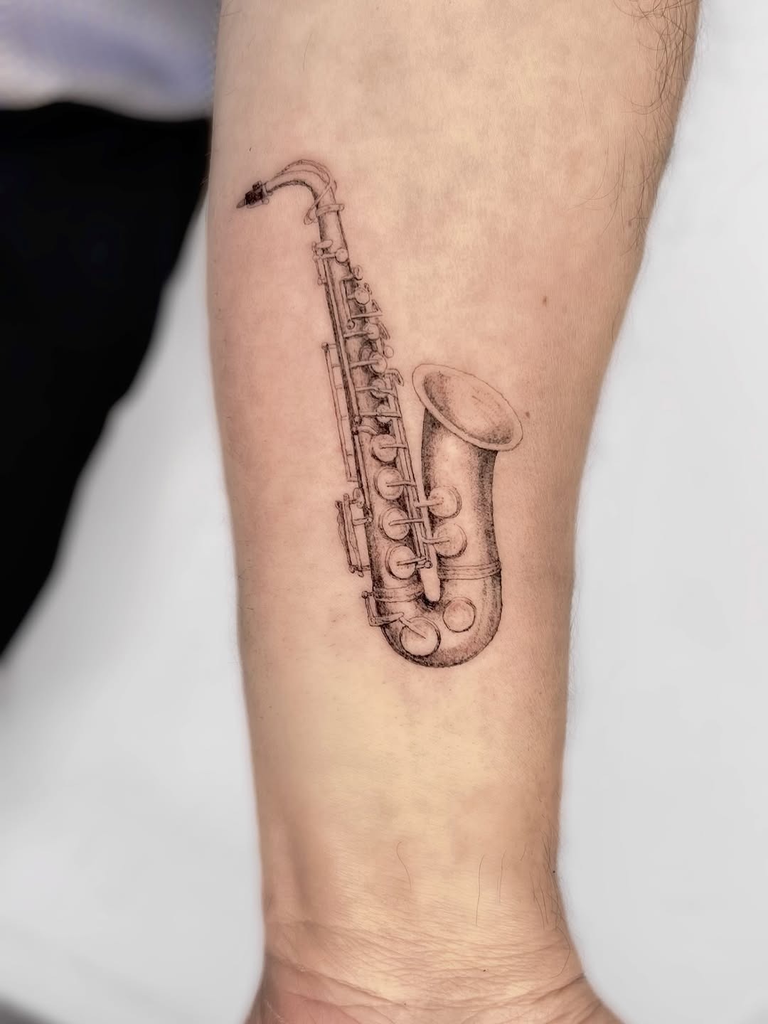 A stunning saxophone tattoo for music lovers Tattoo Design