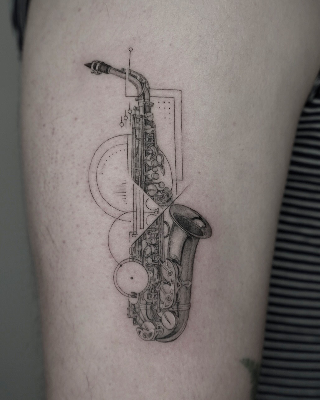 Elegant fine line saxophone tattoo design Tattoo Design