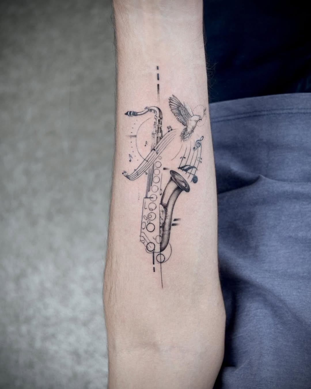 Elegant saxophone tattoo with musical notes Tattoo Design