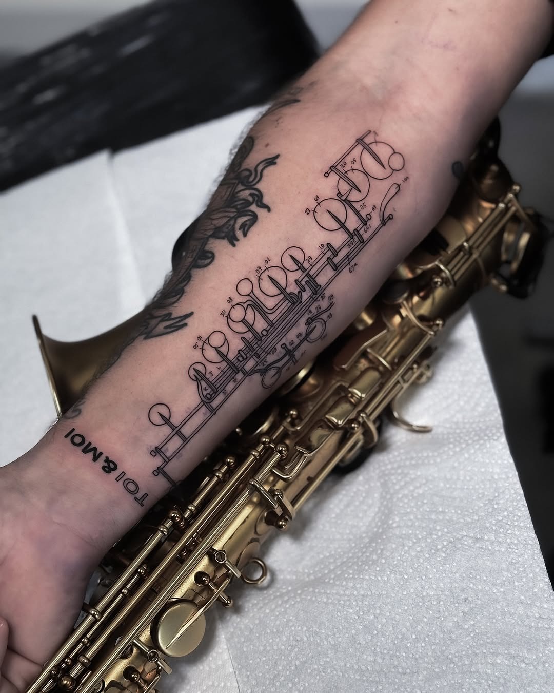 Elegant tattoo blending music with artistry Tattoo Design