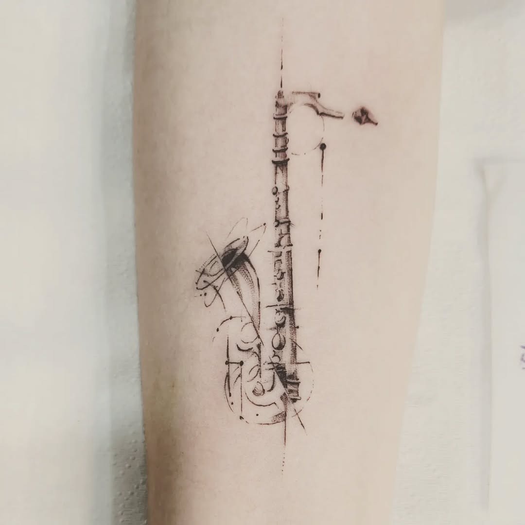 Stylish saxophone tattoo with elegant lines Tattoo Design