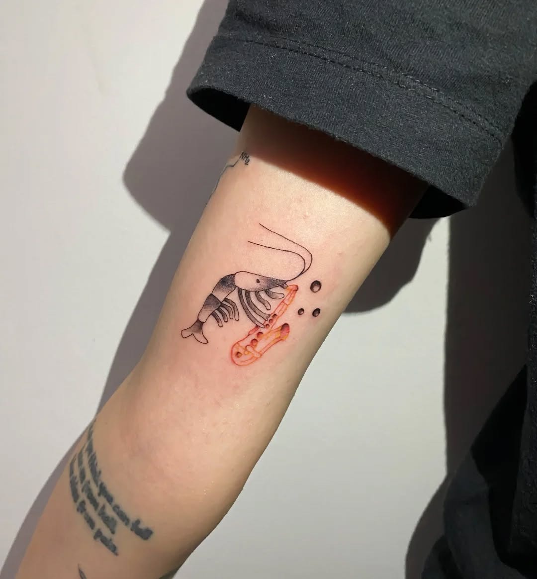 Unique saxophone design with a shrimp twist Tattoo Design