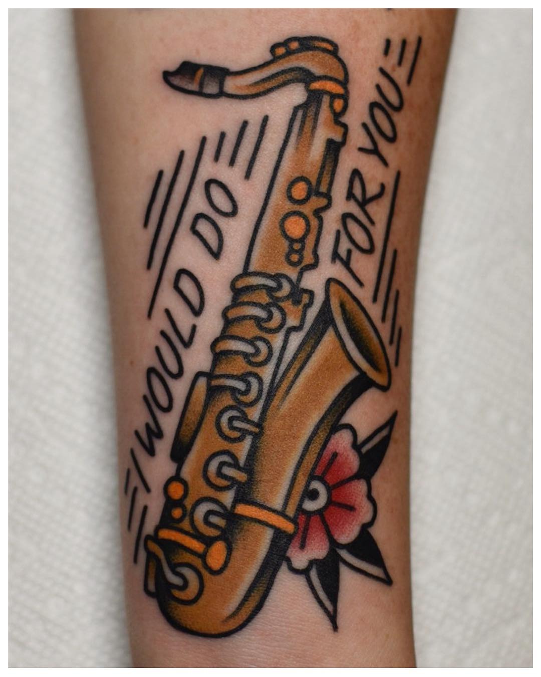 Unique saxophone tattoo with heartfelt quote Tattoo Design