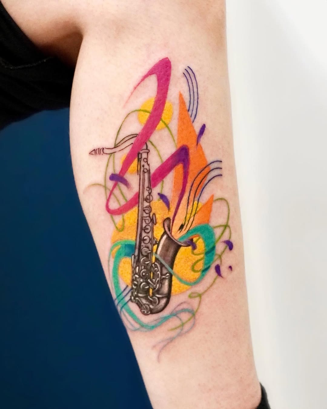 Vibrant saxophone tattoo with artistic flair Tattoo Design