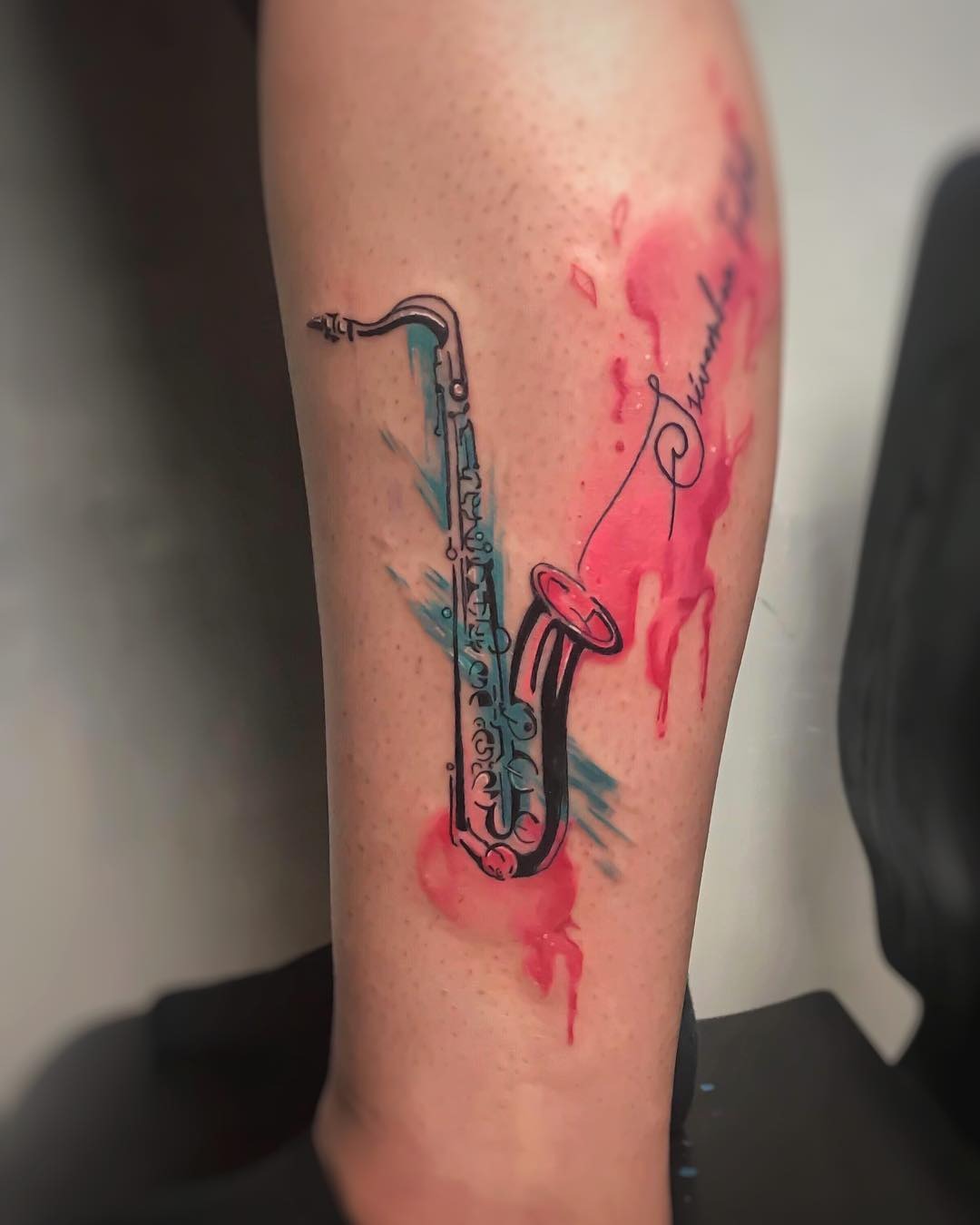 Vibrant saxophone tattoo with splashy colors Tattoo Design