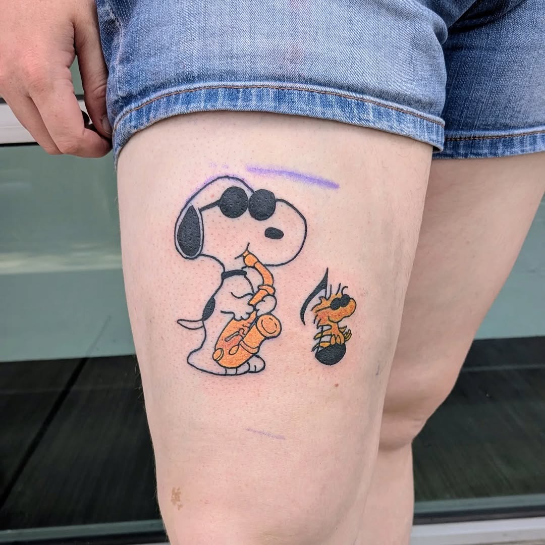 Whimsical saxophone-playing Snoopy tattoo design Tattoo Design