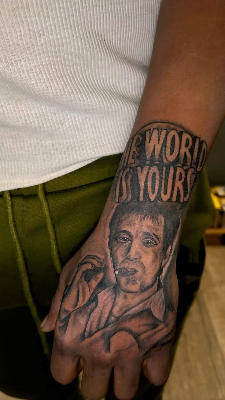 Globe Emblem With Intense Tony Stark Tattoo Design