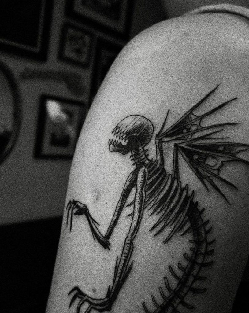 Swinging from a Skull Tattoo Design