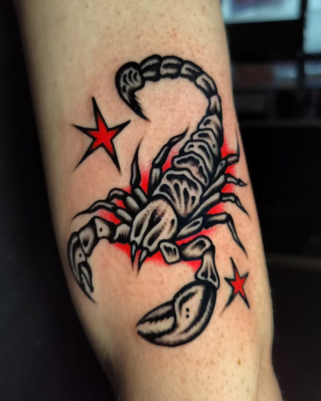 Bold Scorpio Tattoo with Striking Red Accents Tattoo Design